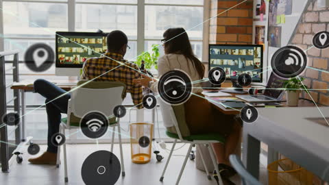 Innovative Team Collaborating on Digital Technology in Modern Office