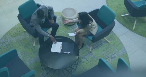 Executives Discussing Ideas in Modern Corporate Lounge