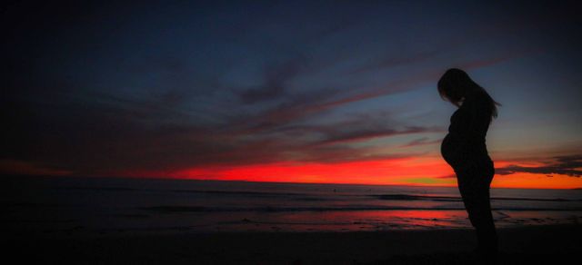 Pregnant Silhouette During Sunset at Beach - Download Free Stock Images Pikwizard.com