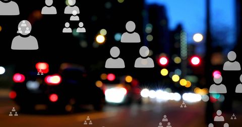 Digital Composite of Social Media Icons Over Busy Night City Scenario