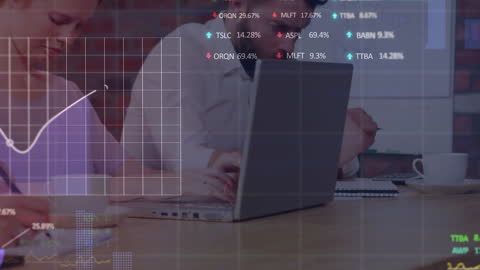Colleagues Analyzing Stock Market Data in Office Environment