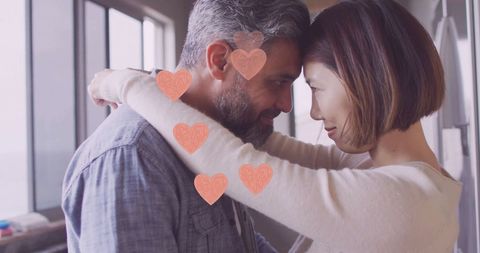 Diverse Couple Embracing with Hearts Symbolizing Love and Togetherness