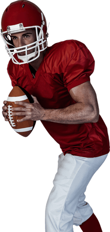 American football player holding ball with determined pose in red uniform
