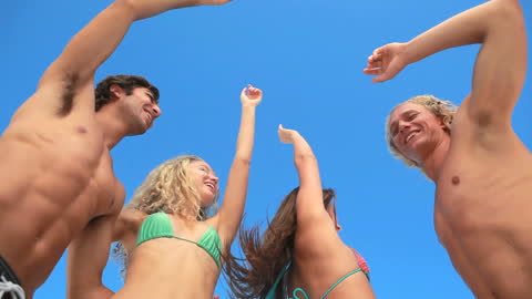 Joyful Friends Having Fun Under Blue Sky