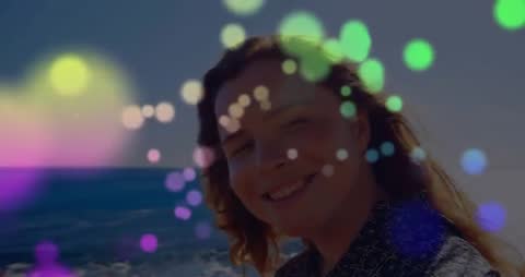Woman Embracing Tranquility by Ocean with Bokeh Light
