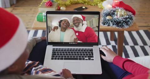 Family Connected via Video Call Celebrating with Holiday Spirit