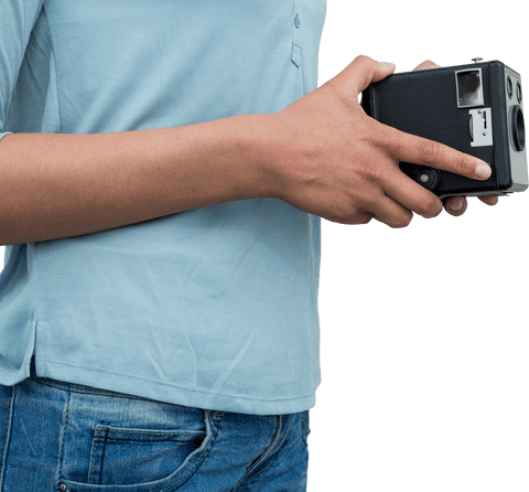 transparent close-up of photographer holding vintage camera film equipment - Download Free Stock Videos Pikwizard.com
