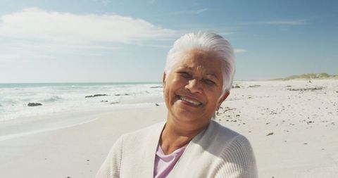 Senior Woman Smiling on Sunny Beach