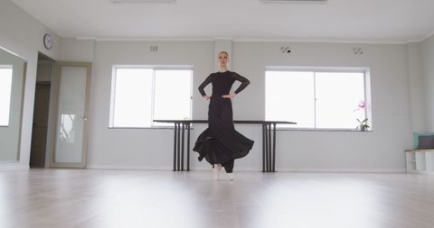 Ballet Dancer Practicing Graceful Movements in Dance Studio