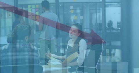 Business Team Analyzing Decline in Office with Graph Overlay