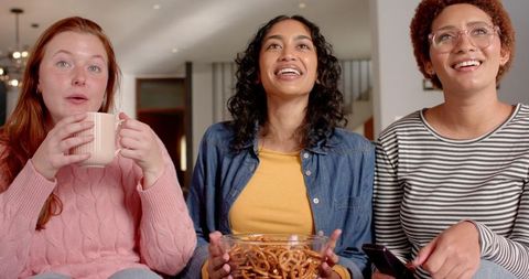 Diverse Female Friends Relaxing and Enjoying Snack Time