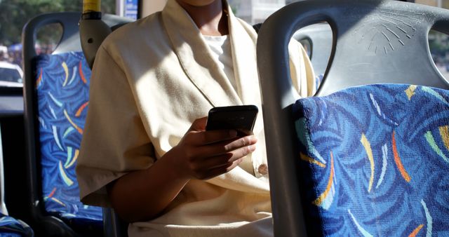 Bus Commuter Engrossed with Smartphone - Download Free Stock Images Pikwizard.com