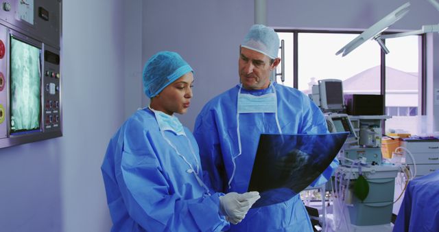 Professionals analyzing X-ray in modern surgical room - Download Free Stock Images Pikwizard.com