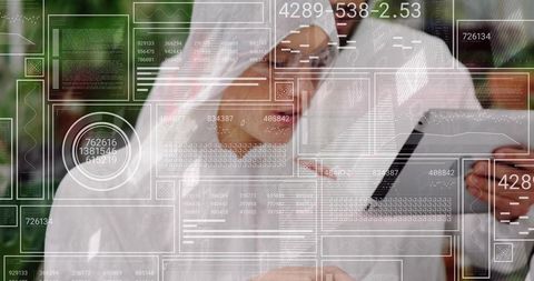 Man interacting with futuristic transparent display in modern office