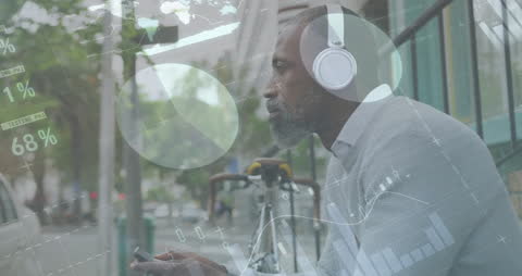 Man with Headphones Overlaid with Data and Graphs