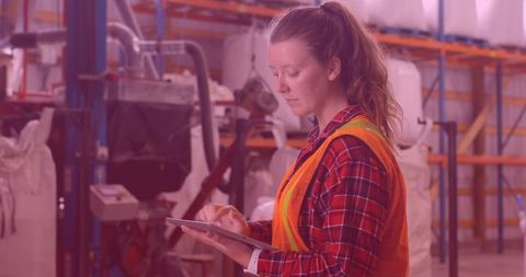 Warehouse Worker Using Tablet Efficiently in Busy Environment - Download Free Stock Images Pikwizard.com