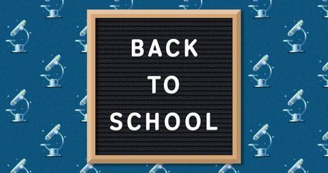 Back to School Message on Blackboard With Microscope Pattern