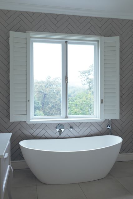 Modern Bathroom with Freestanding Bathtub and Large Window - Download Free Stock Photos Pikwizard.com