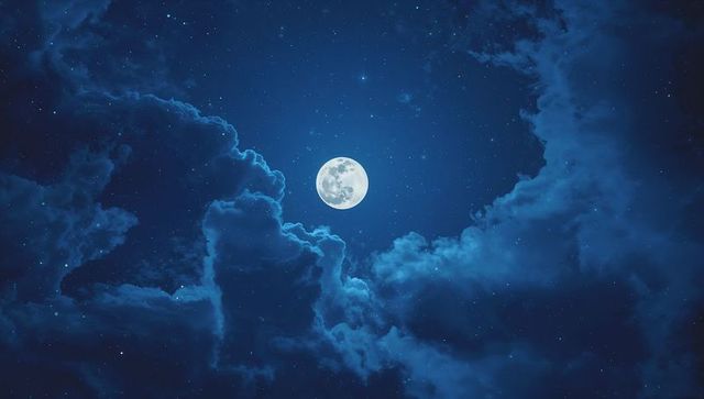 Full Moon Illuminates Cloudy Night Sky Stars