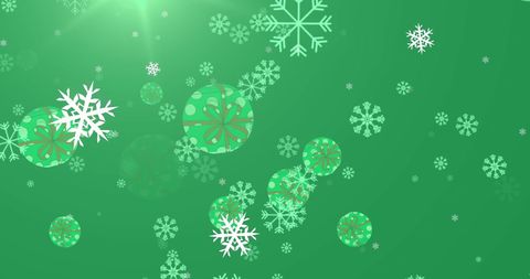 festive falling snowflakes and baubles on green background - Download Free Stock Images Pikwizard.com