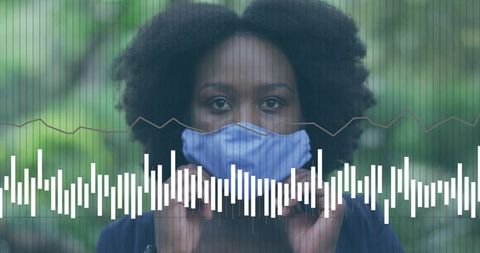 Holding light blue face mask outdoors while waveform overlay visualizes health data and calm wellnes