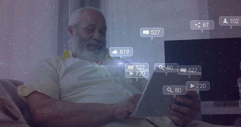 Senior Man Engaging with Technology Relaxing at Home