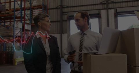 Warehouse Team Managing Inventory with Scanner and Laptop