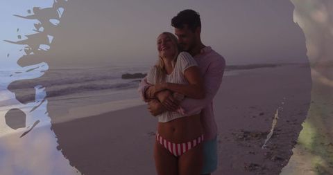 Romantic caucasian couple embracing on serene beach