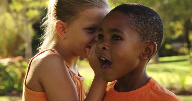 Children Whispering Secrets in Park on Sunny Day - Download Free Stock Images Pikwizard.com