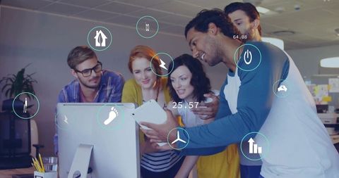 Collaborating team pointing at tablet and monitor with futuristic UI overlays for teamwork
