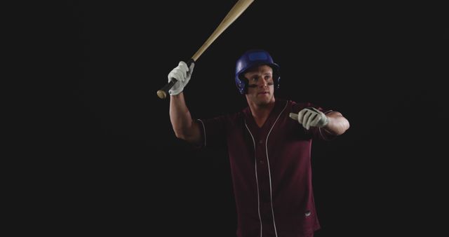 Male Baseball Player Holding Wooden Bat in Batting Stance on Black Background - Download Free Stock Images Pikwizard.com