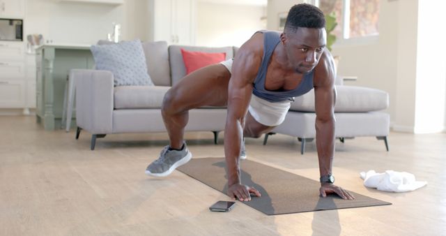 Focused Man Doing Cardio Plank Exercise at Home - Download Free Stock Images Pikwizard.com