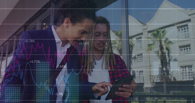 Two business professionals standing outdoors analyzing a tablet displaying financial data with graphs. Ideally used for illustrating concepts of business analysis, teamwork, financial strategy, collaboration in professional settings.