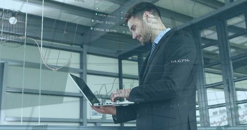 Businessman Processing Financial Data on Laptop in Office - Download Free Stock Images Pikwizard.com
