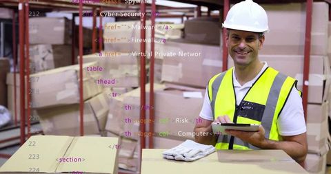 Worker in Warehouse Using Tablet for Inventory Management