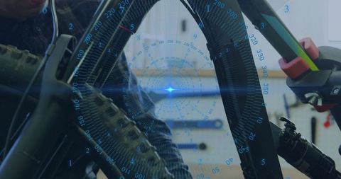 Bicycle wheel alignment with augmented reality assist showing digital measurements in repair worksho