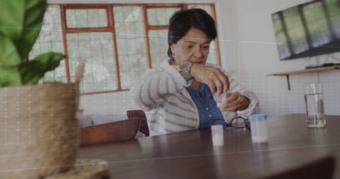Senior Woman with Digital Health Interface Taking Medicine