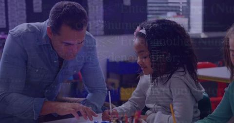 Teacher Assisting Students with Creative Drawing in Classroom