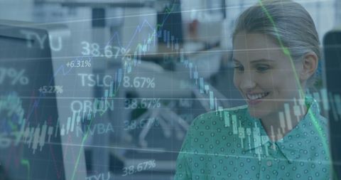 Businesswoman analyzing stock market data on a computer screen