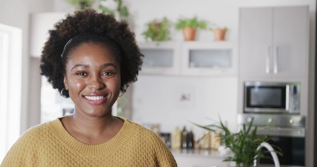 Smiling African American Woman Enjoying Her Modern Kitchen - Download Free Stock Images Pikwizard.com