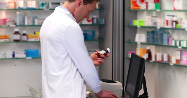 Male Pharmacist Checking Prescription Bottle in Pharmacy - Download Free Stock Images Pikwizard.com