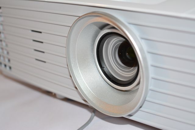 Close-Up of Modern Digital Projector Lens on White Background - Download Free Stock Images Pikwizard.com