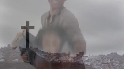 Smiling Parent Holding Child in Rocky Landscape with Cross