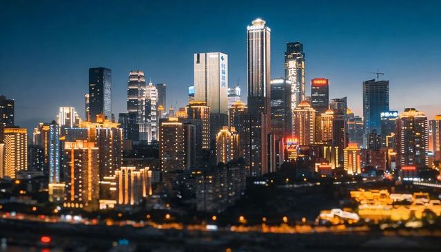 Dusk skyline of illuminated skyscrapers with vertical led signage and glowing crown lights