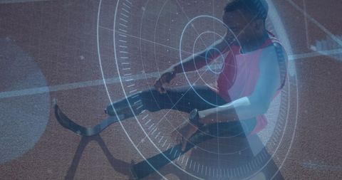Disabled athlete with prosthetic blades and digital interface