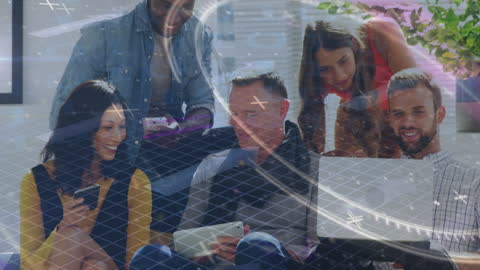 Diverse Team Collaborating on Digital Devices with Data Visualization