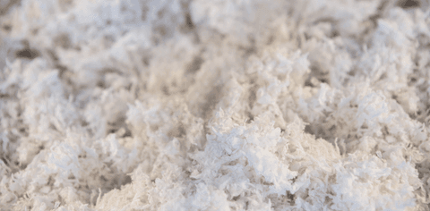 Soft focus texture of white fluffy fiber on transparent surface