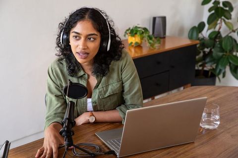 Woman Recording Podcast at Home Studio Desk