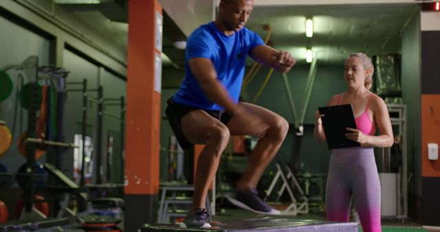 Fitness Trainer Supervising Man Doing Plyometric Exercises in Gym - Download Free Stock Images Pikwizard.com