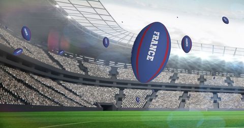 Rugby Mania: Blue Balls Soaring Over Stadium - Download Free Stock Images Pikwizard.com